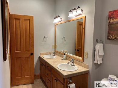 Step into this exceptional multifamily duplex home, nestled in on Trillium Links in North Carolina - for sale on GolfHomes.com, golf home, golf lot