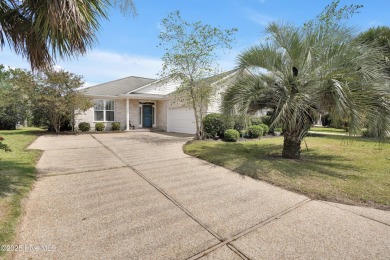 Beautiful all-brick home boasts an open layout that immediately on Magnolia Greens Golf Plantation in North Carolina - for sale on GolfHomes.com, golf home, golf lot