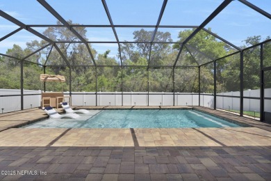 This Palencia pool home offers serene preserve views & plenty of on The Palencia Club in Florida - for sale on GolfHomes.com, golf home, golf lot