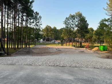 This fabulous new construction home invites you in with both the on Granada Golf Course in Arkansas - for sale on GolfHomes.com, golf home, golf lot