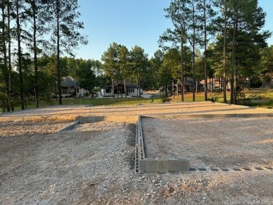 This fabulous new construction home invites you in with both the on Granada Golf Course in Arkansas - for sale on GolfHomes.com, golf home, golf lot