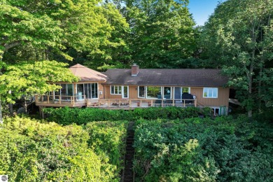 Nestled high among the woods, this lovely residence offers on Crystal Downs Country Club in Michigan - for sale on GolfHomes.com, golf home, golf lot