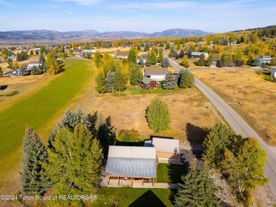 Two contiguous lots on the 10th fairway offer both beautiful on Cedar Creek Golf Course in Wyoming - for sale on GolfHomes.com, golf home, golf lot