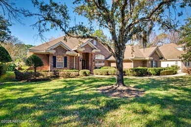 This delightful 5-bedroom, 3-bathroom custom brick home is a on Country Club of Orange Park in Florida - for sale on GolfHomes.com, golf home, golf lot
