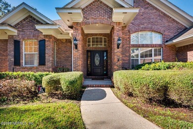 This delightful 5-bedroom, 3-bathroom custom brick home is a on Country Club of Orange Park in Florida - for sale on GolfHomes.com, golf home, golf lot