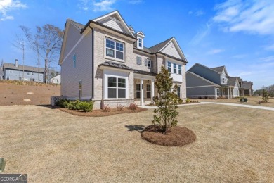Nestled in the sought-after Traditions of Braselton community on Traditions of Braselton Golf Club in Georgia - for sale on GolfHomes.com, golf home, golf lot