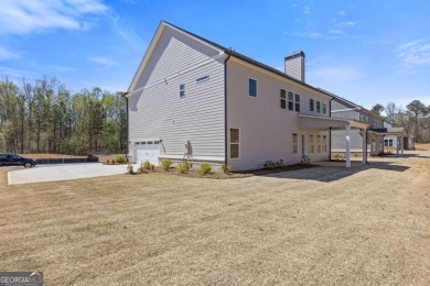Nestled in the sought-after Traditions of Braselton community on Traditions of Braselton Golf Club in Georgia - for sale on GolfHomes.com, golf home, golf lot