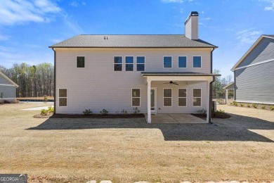 Nestled in the sought-after Traditions of Braselton community on Traditions of Braselton Golf Club in Georgia - for sale on GolfHomes.com, golf home, golf lot