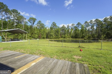 Live on vacation when you make 1653 Hawthorne Rd in the Shellman on Sapelo Hammock Golf Club in Georgia - for sale on GolfHomes.com, golf home, golf lot