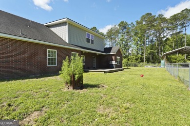 Live on vacation when you make 1653 Hawthorne Rd in the Shellman on Sapelo Hammock Golf Club in Georgia - for sale on GolfHomes.com, golf home, golf lot