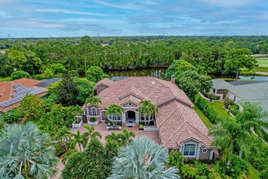 STUNNING, CUSTOM DESIGNED RESIDENCE, PERFECTLY SITUATED ON A 1/2 on The Legacy Golf and Tennis Club in Florida - for sale on GolfHomes.com, golf home, golf lot