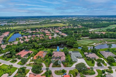 STUNNING, CUSTOM DESIGNED RESIDENCE, PERFECTLY SITUATED ON A 1/2 on The Legacy Golf and Tennis Club in Florida - for sale on GolfHomes.com, golf home, golf lot