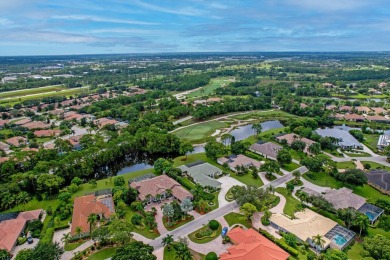 STUNNING, CUSTOM DESIGNED RESIDENCE, PERFECTLY SITUATED ON A 1/2 on The Legacy Golf and Tennis Club in Florida - for sale on GolfHomes.com, golf home, golf lot