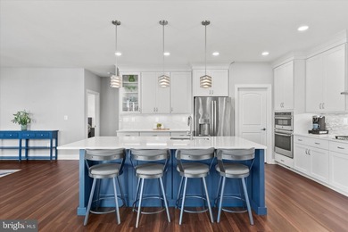 The welcoming covered entry of 33418 Islander Drive invites you on The Peninsula Golf and Country Club in Delaware - for sale on GolfHomes.com, golf home, golf lot