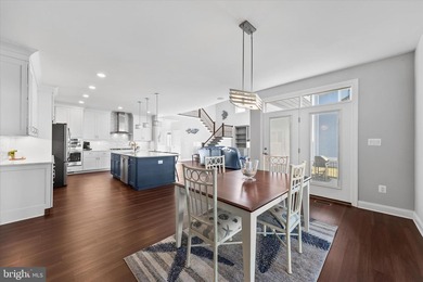 The welcoming covered entry of 33418 Islander Drive invites you on The Peninsula Golf and Country Club in Delaware - for sale on GolfHomes.com, golf home, golf lot