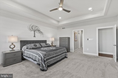 The welcoming covered entry of 33418 Islander Drive invites you on The Peninsula Golf and Country Club in Delaware - for sale on GolfHomes.com, golf home, golf lot