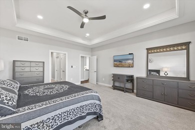 The welcoming covered entry of 33418 Islander Drive invites you on The Peninsula Golf and Country Club in Delaware - for sale on GolfHomes.com, golf home, golf lot