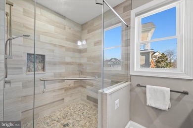 The welcoming covered entry of 33418 Islander Drive invites you on The Peninsula Golf and Country Club in Delaware - for sale on GolfHomes.com, golf home, golf lot