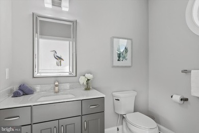 The welcoming covered entry of 33418 Islander Drive invites you on The Peninsula Golf and Country Club in Delaware - for sale on GolfHomes.com, golf home, golf lot