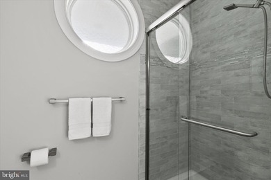 The welcoming covered entry of 33418 Islander Drive invites you on The Peninsula Golf and Country Club in Delaware - for sale on GolfHomes.com, golf home, golf lot