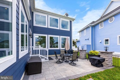 The welcoming covered entry of 33418 Islander Drive invites you on The Peninsula Golf and Country Club in Delaware - for sale on GolfHomes.com, golf home, golf lot