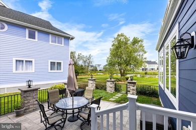 The welcoming covered entry of 33418 Islander Drive invites you on The Peninsula Golf and Country Club in Delaware - for sale on GolfHomes.com, golf home, golf lot
