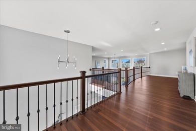 The welcoming covered entry of 33418 Islander Drive invites you on The Peninsula Golf and Country Club in Delaware - for sale on GolfHomes.com, golf home, golf lot