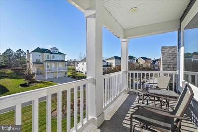 The welcoming covered entry of 33418 Islander Drive invites you on The Peninsula Golf and Country Club in Delaware - for sale on GolfHomes.com, golf home, golf lot