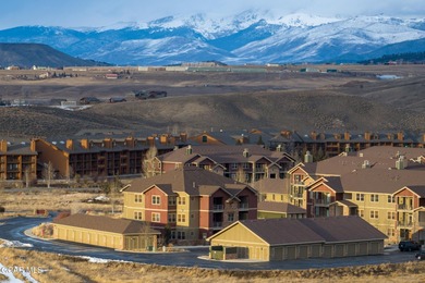 Wake up to panoramic mountain views, spend your days skiing or on Headwaters Golf Course At Granby Ranch in Colorado - for sale on GolfHomes.com, golf home, golf lot