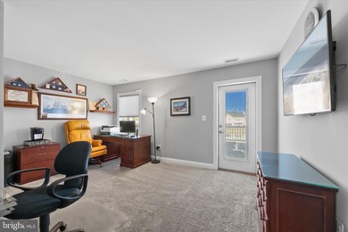 The welcoming covered entry of 33418 Islander Drive invites you on The Peninsula Golf and Country Club in Delaware - for sale on GolfHomes.com, golf home, golf lot