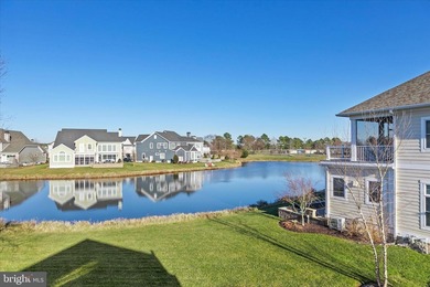 The welcoming covered entry of 33418 Islander Drive invites you on The Peninsula Golf and Country Club in Delaware - for sale on GolfHomes.com, golf home, golf lot