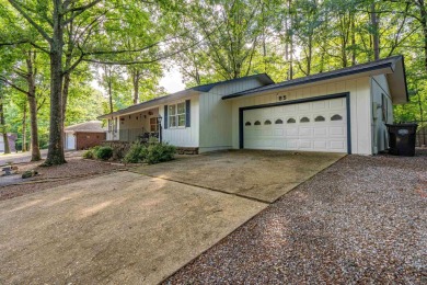 Nestled on a quiet street and surrounded by mature trees, this on DeSoto Golf Course in Arkansas - for sale on GolfHomes.com, golf home, golf lot