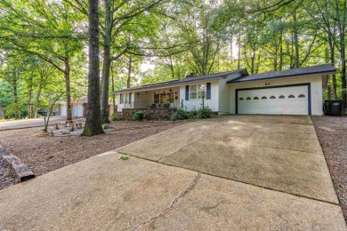 Nestled on a quiet street and surrounded by mature trees, this on DeSoto Golf Course in Arkansas - for sale on GolfHomes.com, golf home, golf lot