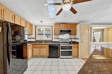 LAND OWNED-NO LAND LEASE! Welcome to 2629 Caper Court in the on Spanish Lakes Golf Village in Florida - for sale on GolfHomes.com, golf home, golf lot