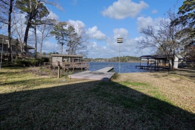 Welcome to your waterfront home! Discover the perfect blend of on Hide-A-Way Lake Golf Course in Texas - for sale on GolfHomes.com, golf home, golf lot