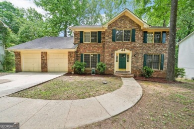 Welcome to this beautiful brick front home nestled on a sweeping on Hidden Hills Country Club in Georgia - for sale on GolfHomes.com, golf home, golf lot