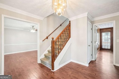 Welcome to this beautiful brick front home nestled on a sweeping on Hidden Hills Country Club in Georgia - for sale on GolfHomes.com, golf home, golf lot