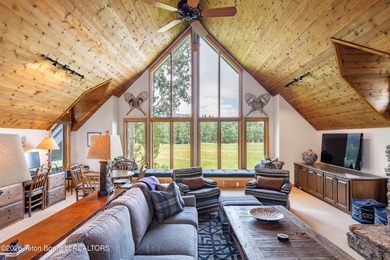 Bordering the 11th fairway of the prestigious Teton Pines golf on Teton Pines Golf Club in Wyoming - for sale on GolfHomes.com, golf home, golf lot