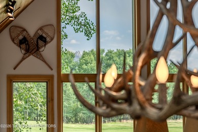 Bordering the 11th fairway of the prestigious Teton Pines golf on Teton Pines Golf Club in Wyoming - for sale on GolfHomes.com, golf home, golf lot