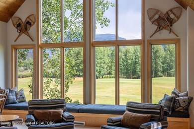 Bordering the 11th fairway of the prestigious Teton Pines golf on Teton Pines Golf Club in Wyoming - for sale on GolfHomes.com, golf home, golf lot