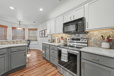 Don't miss this beautifully updated home offering a 3-car garage on Bella Vista - Metfield Golf Complex and Country Club in Arkansas - for sale on GolfHomes.com, golf home, golf lot