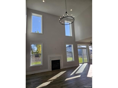 Ready to move in - includes the irrigation system, sod, and on St Clair River Country Club in Michigan - for sale on GolfHomes.com, golf home, golf lot