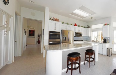 This Stunning Golf Course Emerald Model Is Perfectly Positioned on Mountain Vista Golf Course At Sun City Palm Desert in California - for sale on GolfHomes.com, golf home, golf lot