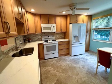 2nd FLOOR CORNER with WIDE GOLF/LAKE/POOL VIEW Plus HURRICANE on Wynmoor Golf Course in Florida - for sale on GolfHomes.com, golf home, golf lot