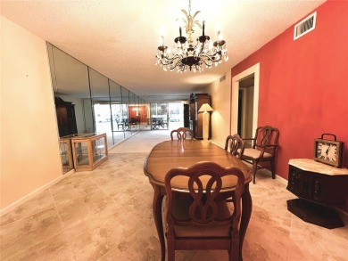 2nd FLOOR CORNER with WIDE GOLF/LAKE/POOL VIEW Plus HURRICANE on Wynmoor Golf Course in Florida - for sale on GolfHomes.com, golf home, golf lot