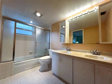 2nd FLOOR CORNER with WIDE GOLF/LAKE/POOL VIEW Plus HURRICANE on Wynmoor Golf Course in Florida - for sale on GolfHomes.com, golf home, golf lot