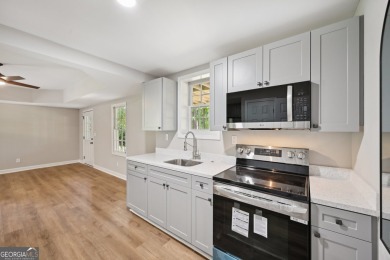 Welcome to this beautifully renovated 5-bedroom, 3.5-bathroom on Brookstone Golf and Country Club in Georgia - for sale on GolfHomes.com, golf home, golf lot