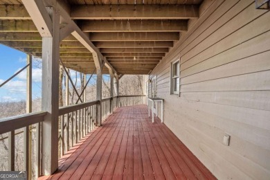 THAT VIEW . . . This perfect mountain cabin sits at over 3000 on Big Canoe Golf Club - Cherokee in Georgia - for sale on GolfHomes.com, golf home, golf lot