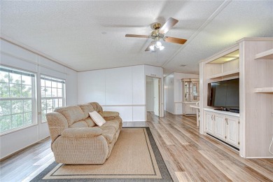 Immaculately maintained Palm Harbor home in picturesque Betmar on Betmar Acres Golf Club in Florida - for sale on GolfHomes.com, golf home, golf lot