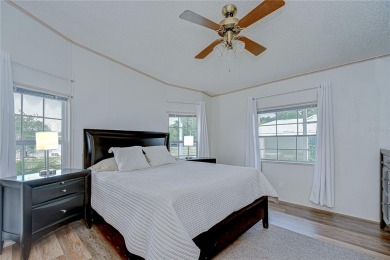 Immaculately maintained Palm Harbor home in picturesque Betmar on Betmar Acres Golf Club in Florida - for sale on GolfHomes.com, golf home, golf lot